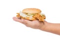 Hand holding a fried chicken burger isolate on white Royalty Free Stock Photo