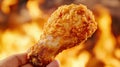 A hand holding a fried chicken wing in front of flames, AI Royalty Free Stock Photo