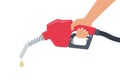 Hand holding a fuel pump. Yellow drop of oil Royalty Free Stock Photo