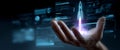Hand holding a futuristic holographic rocket launching with digital interface and data visualization in dark background Royalty Free Stock Photo