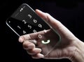 Hand holding futuristic transparent smartphone