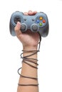 Hand holding game controller and tied up with cables Royalty Free Stock Photo