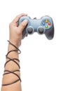 Hand holding game controller and tied up with cables Royalty Free Stock Photo