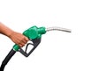 Hand holding gas nozzle with one last drop. A man holding a green gasoline nozzle on a white background. Royalty Free Stock Photo