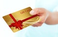 Hand holding gift card isolated over white Royalty Free Stock Photo