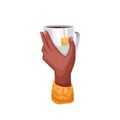 Hand holding glass cup with black tea, teabag hanging on isolated mug with Ceylon tea
