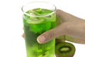 Hand holding a glass of kiwi juice Royalty Free Stock Photo