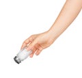 Hand holding a glass salt shaker Royalty Free Stock Photo