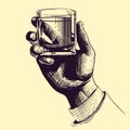 Hand holding glass with strong drink. Vintage drawing vector illustration