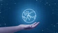Hand holding globe network concept. Binary code in background and network threads Royalty Free Stock Photo