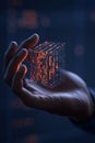 hand holding glowing holographic cube with digital patterns