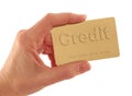 Hand Holding Gold Credit Card with Text on White Royalty Free Stock Photo