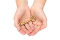 Hand holding a gold key Royalty Free Stock Photo