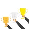 Hand holding gold trophy cup vector. Royalty Free Stock Photo