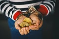 Hand holding golden Bitcoin. Criminal man with handcuffs after committed a crime Royalty Free Stock Photo