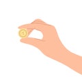 Hand holding a golden coin Royalty Free Stock Photo