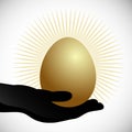 Hand Holding Golden Egg