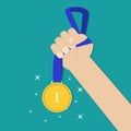 Hand holding golden medal Royalty Free Stock Photo