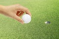 Hand holding golf ball Royalty Free Stock Photo