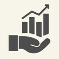 Hand holding graph solid icon. Growth chart in palm vector illustration isolated on white. Management glyph style design