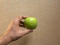 Hand holding Granny Smith apple Royalty Free Stock Photo