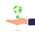 Hand holding green earth in light bulb Royalty Free Stock Photo