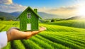 Hand Holding a Green Eco Small Wooden Model House on Green Field - Generative Ai Royalty Free Stock Photo