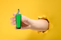 Hand holding a green highlighter Royalty Free Stock Photo