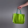 Hand holding a green recycle green bag , eco friendly shopping o Royalty Free Stock Photo