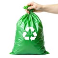 Hand holding a green recycling plastic bag isolated on white background Royalty Free Stock Photo