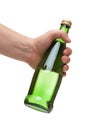 Hand holding a green transparent bottle