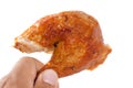 Hand holding grilled Drumstick chicken Royalty Free Stock Photo