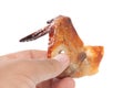 Hand holding grilled Drumstick chicken Royalty Free Stock Photo