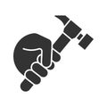 Hand holding hammer glyph icon Royalty Free Stock Photo
