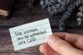 Hand holding handwritten note: Nothing will be impossible with God, close-up Royalty Free Stock Photo