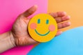 Hand holding happy smile face and sad paper cut, Positive thinking, Mental health assessment , World mental health day concept. A Royalty Free Stock Photo