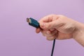 Hand holding HDMI cable Royalty Free Stock Photo