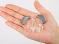 Hand holding hearing aid Royalty Free Stock Photo