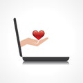 Hand holding heart comes from laptop screen