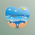 Hand holding heart shape with ocean wave paper art style. Royalty Free Stock Photo