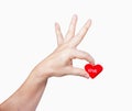 Hand holding heart-shaped isolated over white,clipping path