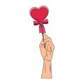 Hand holding heartshape lollipop pop art