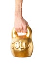 A hand holding heavy weight of gold Royalty Free Stock Photo