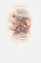 hand holding hourglass on empty space Royalty Free Stock Photo