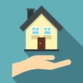 Hand holding house icon, flat style Royalty Free Stock Photo