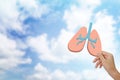 Hand holding human lung icon at background Royalty Free Stock Photo