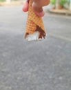 Hand Holding Ice Cream Cones with Chocolate