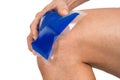 Hand holding ice gel pack on knee Royalty Free Stock Photo