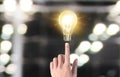 Hand of holding illuminated light bulb, idea, innovation inspiration concept Royalty Free Stock Photo