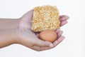 hand holding instant noodles and egg isolated on white background Royalty Free Stock Photo